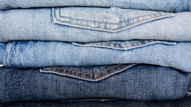 stack of denim jeans