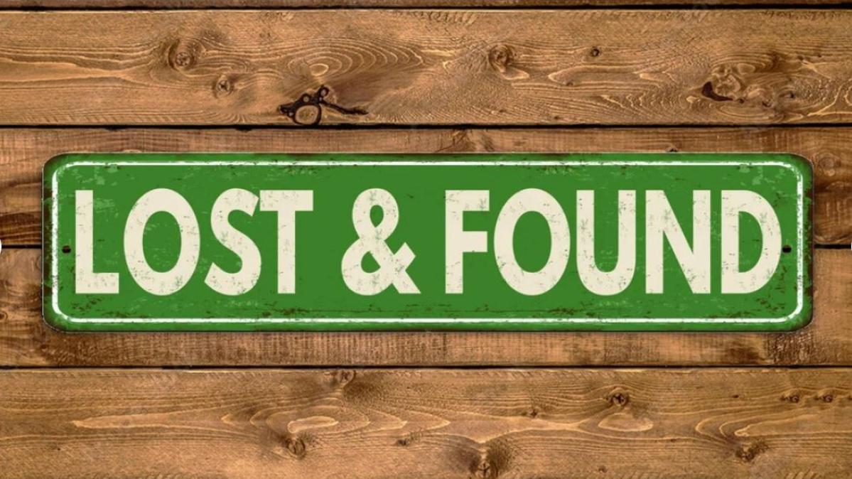 "Lost and Found" sign on wooden background