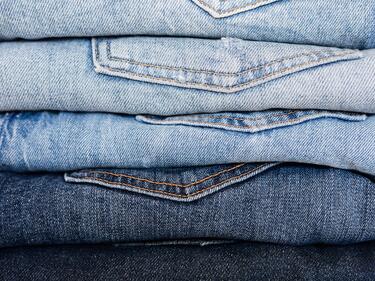 stack of denim jeans