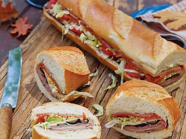 Sub sandwiches on cutting board