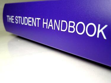The Student Handbook Purple Binder