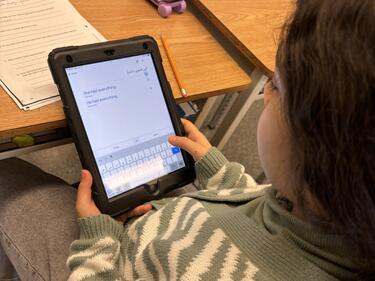 Prince Charles Student Using Translator