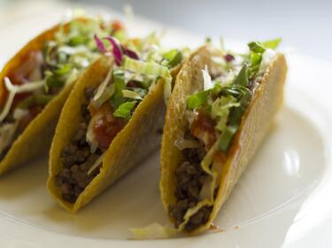 3 tacos on a white plate