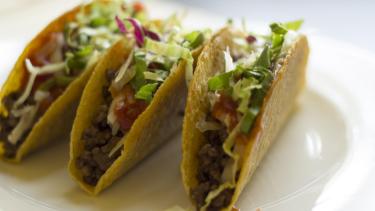 3 tacos on a white plate