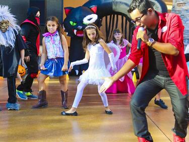 Students dancing in halloween costumes
