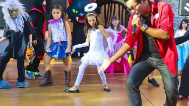 Students dancing in halloween costumes