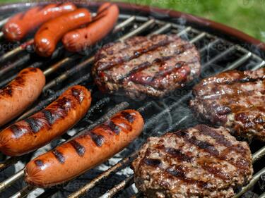 hotdogs and hamburgers on a grill