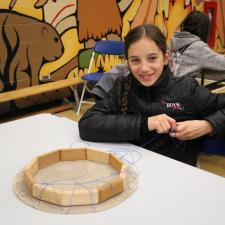 Female grade 5 student poses with their drum